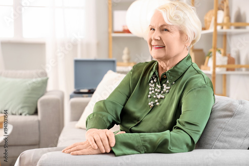 Beautiful senior woman sitt...