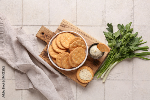 Bowl with tasty crackers, h...