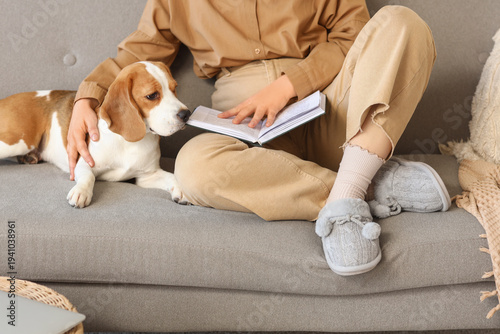 Woman in grey slippers with...