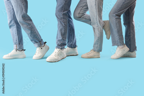 Legs of people in jeans wit...
