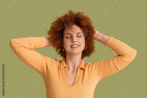 Redhead young woman with cu...