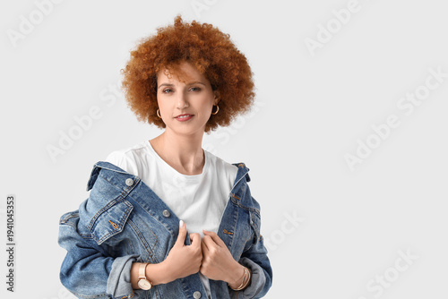 Redhead young woman with cu...