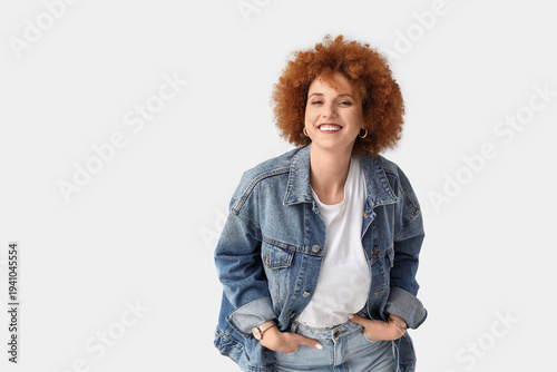 Redhead young woman with cu...