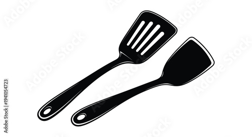 Black and white illustration of a slotted and solid spatula