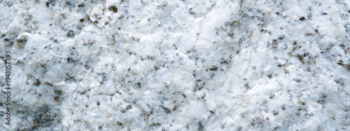 Close up of granite surface texture. Intrusive igneous rock
