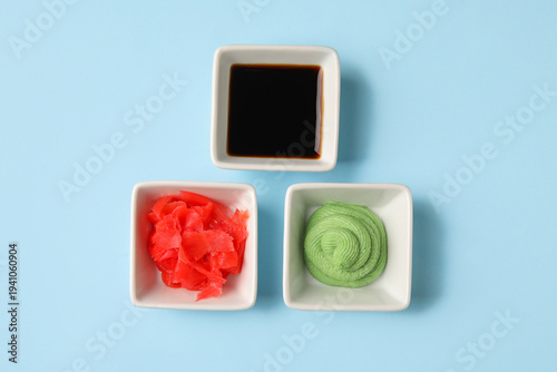 Bowls with wasabi, soy sauc...