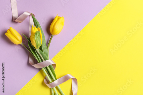 Beautiful bouquet of tulip flowers on color background