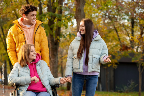 Young woman in wheelchair w...