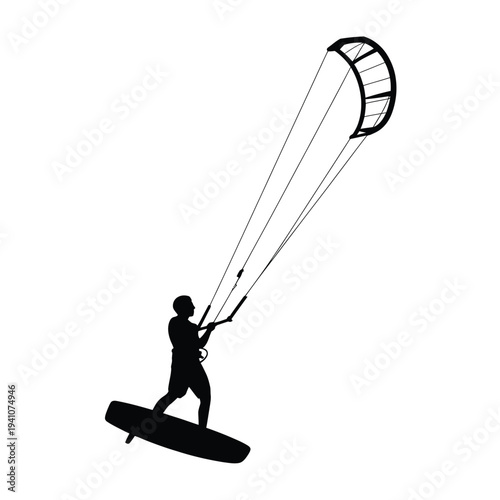 Silhouette of a kitesurfer riding waves with a large kite