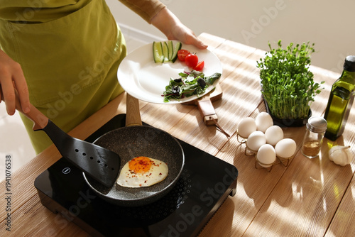 Woman putting over fried ch...