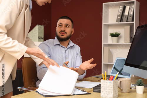 Confused office employee di...