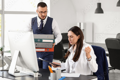 Angry female boss and male ...