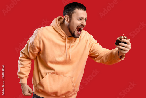 Screaming young man with al...