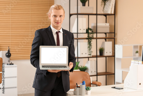 Young businessman with blan...