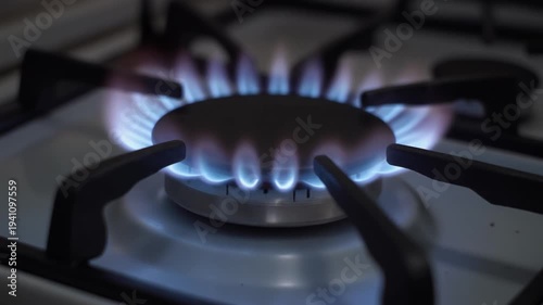 A gas flame on a stove in the kitchen. Symbol for the use of natural gas as an energy source.