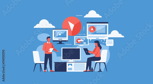 People working on computers together.