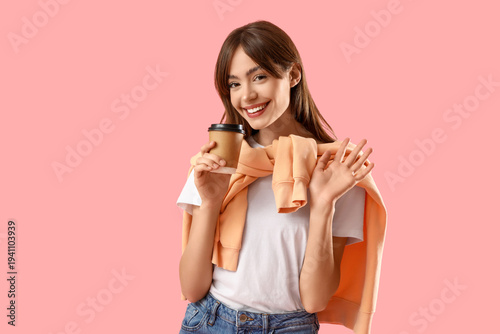 Young woman with coffee cup...