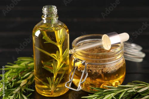 Fresh rosemary with bottle ...