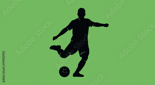 Silhouette of Soccer Player Kicking Ball.