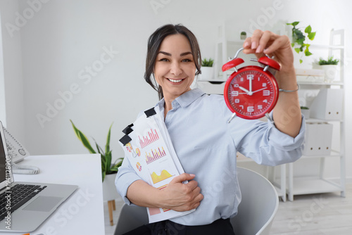 Businesswoman with papers a...