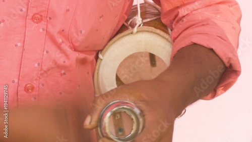 Baul Folk Singer Performing with Ektara at Rural Fair in Kolkata India