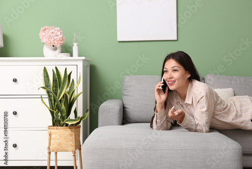 Young Asian woman talking b...