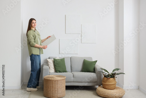 Beautiful young woman hangi...