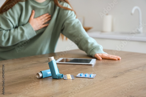 Woman with inhalers, pills ...