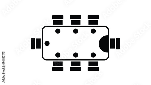 Top-down view of a rectangular conference table with six chairs and two seated figures, illustrating a small meeting or discussion setting.