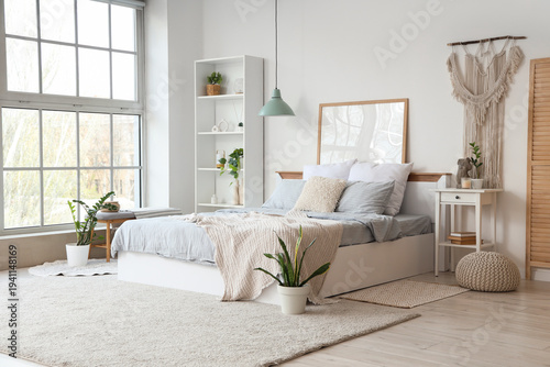 Interior of light bedroom w...