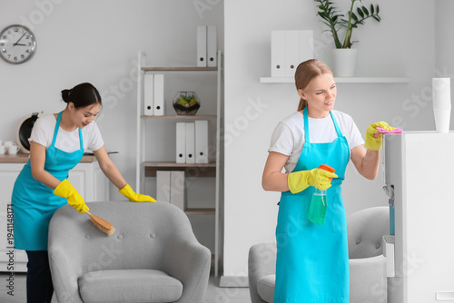 Female janitors cleaning in...