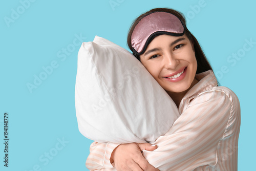Young woman in pajamas with...