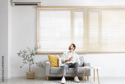 Handsome man using mobile p...