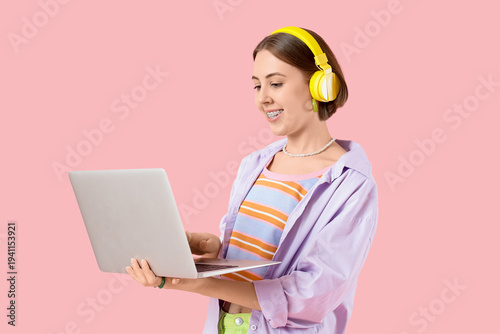 Young woman in headphones w...