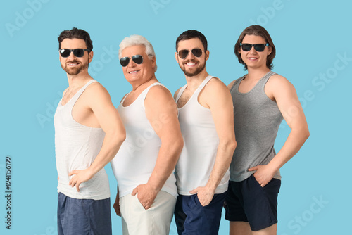 Group of men on blue backgr...