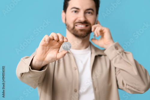 Handsome man with bitcoin t...