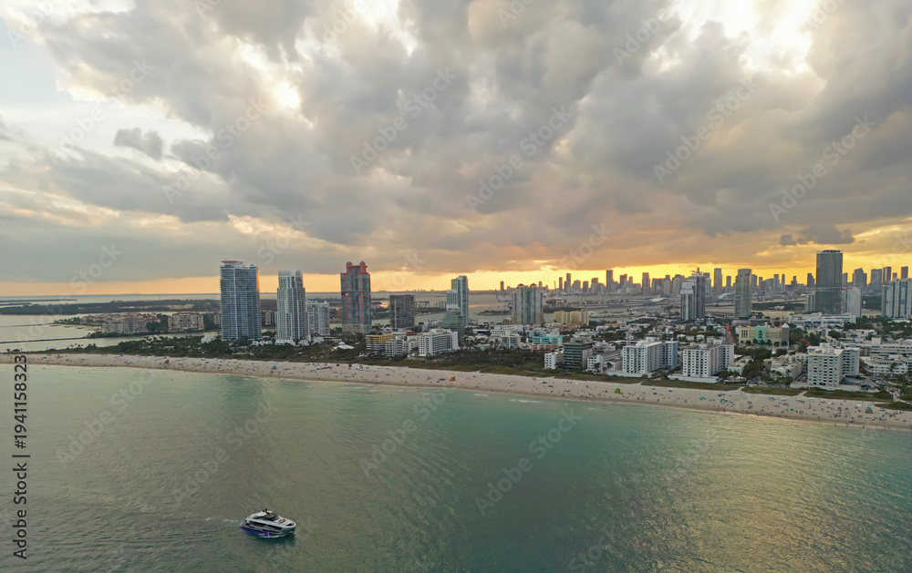 Fototapeta premium Miami pier with south pointe at night. Miami beach waterfront at dusk. Miami city at evening. Miami shoreline.