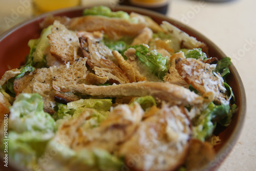 Classic Caesar salad on a plate in a Thai restaurant