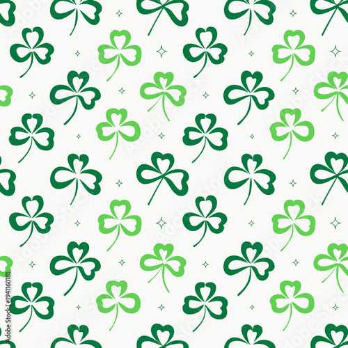 A dense, repeating pattern displays various sizes and shades of three-leaf clovers across a light off-white background for holiday use.
