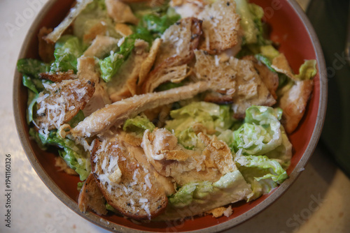Classic Caesar salad on a plate in a Thai restaurant