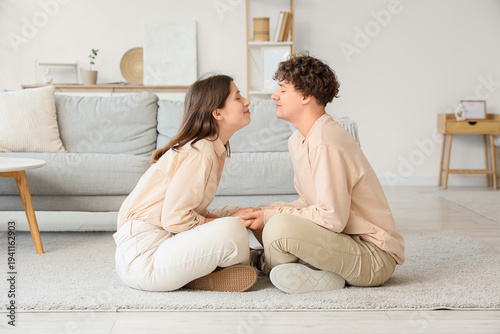 Young couple kissing on flo...