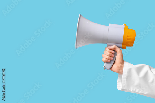 Female hand with megaphone ...