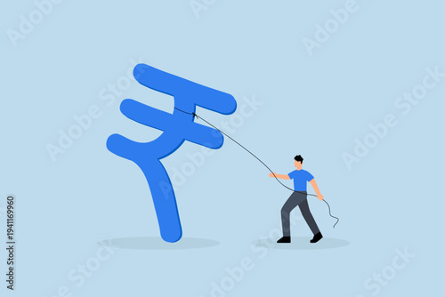 Indian investment opportunity, successful businessman investor is holding big Indian rupee currency symbol