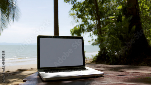 A dreamy beach workspace with laptop, sea waves, sand, palm trees, freedom, relaxation, remote work lifestyle, and perfect vacation-work balance.