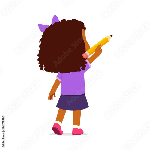 Cheerful African American girl with curly hair holding a large yellow pencil ready to draw or write happily