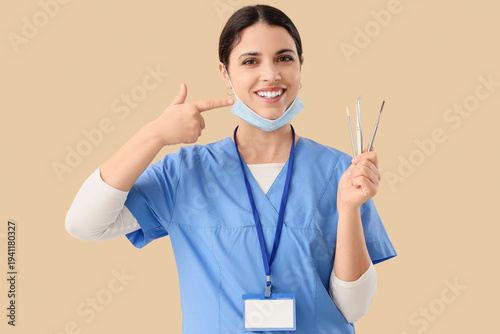 Female dentist with tools p...