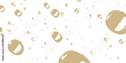 Scattered beige bubbles and droplets on white background