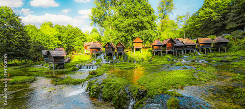 Canvastavla Historic wooden watermills (Mlincici) on the travertine barriers of Plivsko Lake near Jajce, Bosnia and Herzegovina