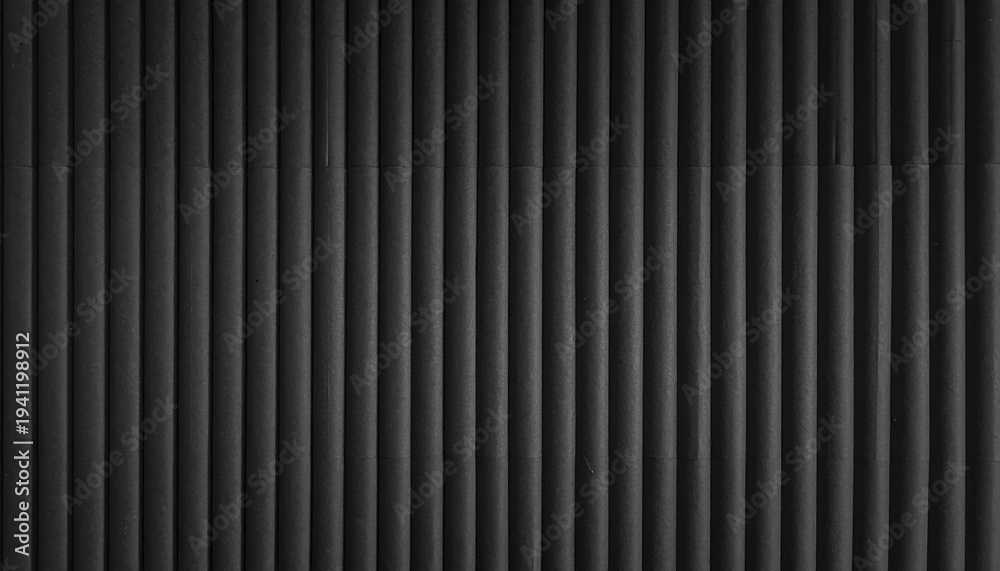 Fototapeta premium Vertical gray textured pipe wall, monochromatic, with slight gradient and cast shadow