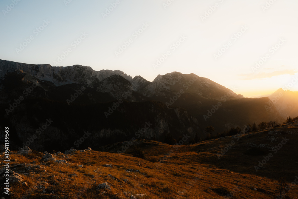 Obraz premium Sunset over the Maglic mountain massif seen from Prijevor saddle in Sutjeska National Park, the highest peak of Bosnia and Herzegovina at golden hour.